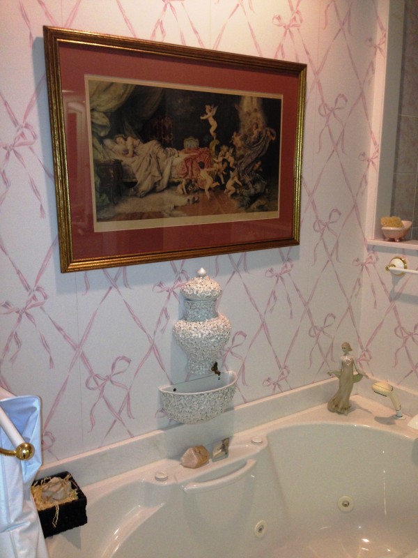 why not formal art and an Italian wall fountain by the bath?