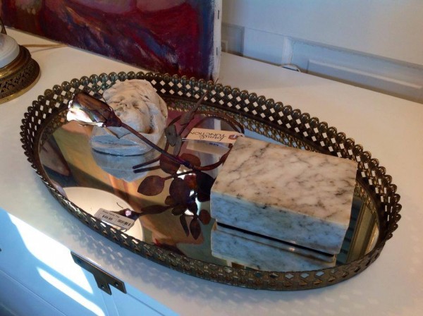 dresser in living room doubles as clothing storage and vanity area for this french girl's studio apartment