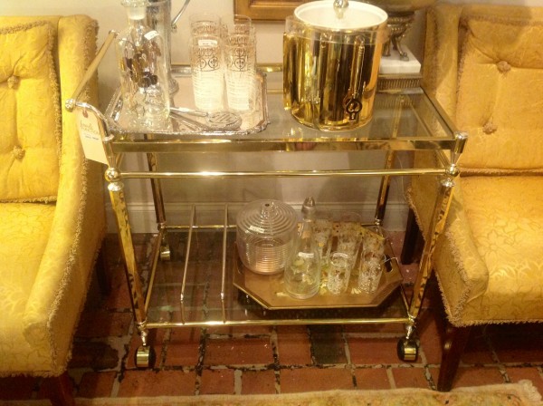 such a functional piece with two shelves and what appears to be two rods at bottom to organize your liquor bottles