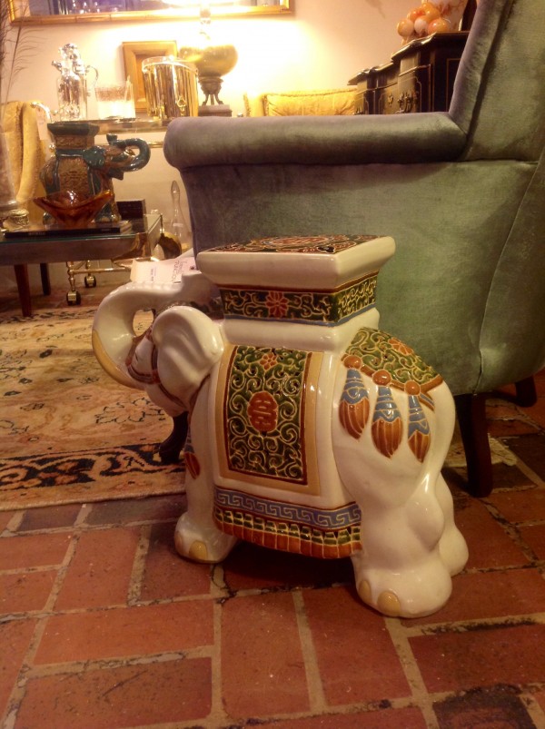 the elephant garden stool is a whimsical addition to the room and serves as an extra perch