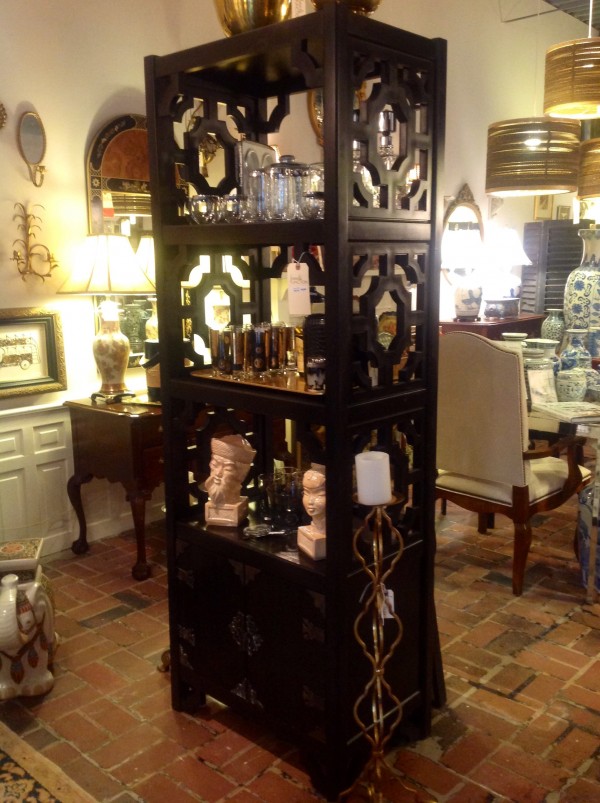 Asian inspired etagere with gorgeous hardware on the lower closed cabinet