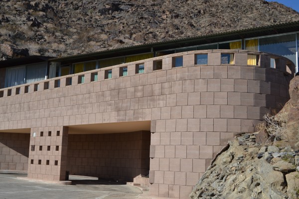 house exterior with carport just large enough for a mini sports car, his favored mode of travel