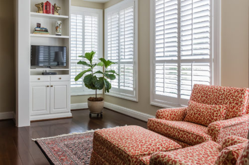 Enclosed sun porch reading tv nook animal print fabric