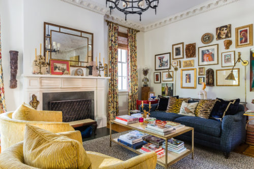 spanish living room leopard rug gallery salon wall