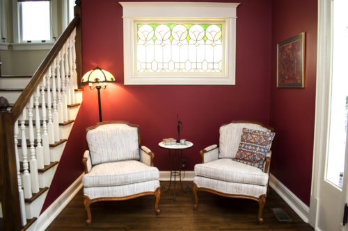 red painted walls french chairs traditional foyer
