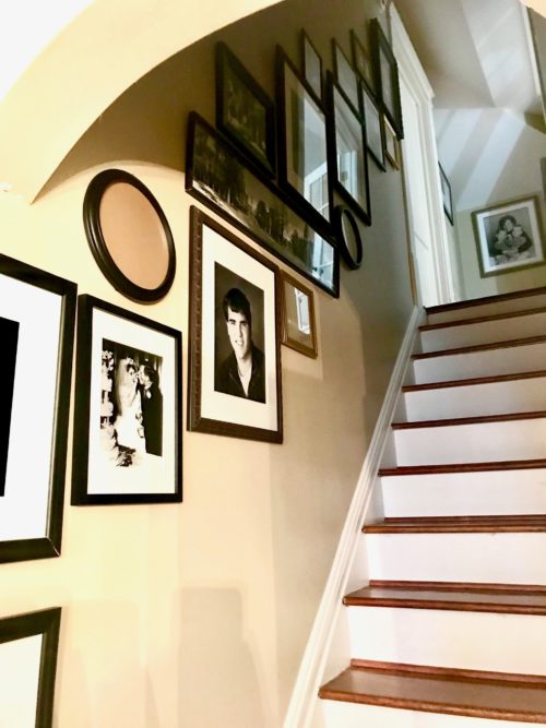 family photo gallery wall art hanging stairwell