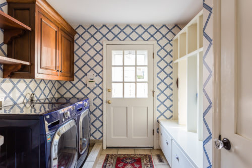 blue and white mudroom spanish house wood cabinets