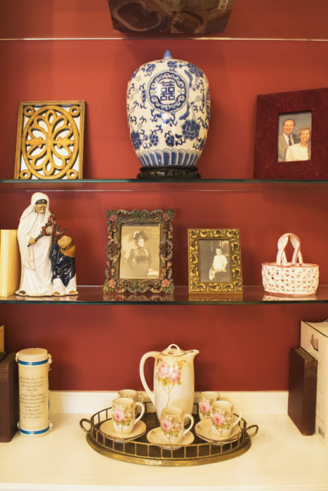 red painted background bookshelves styling