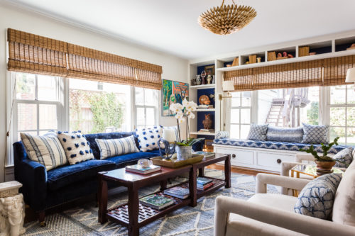 blue and white family room built in bookshelves window seat