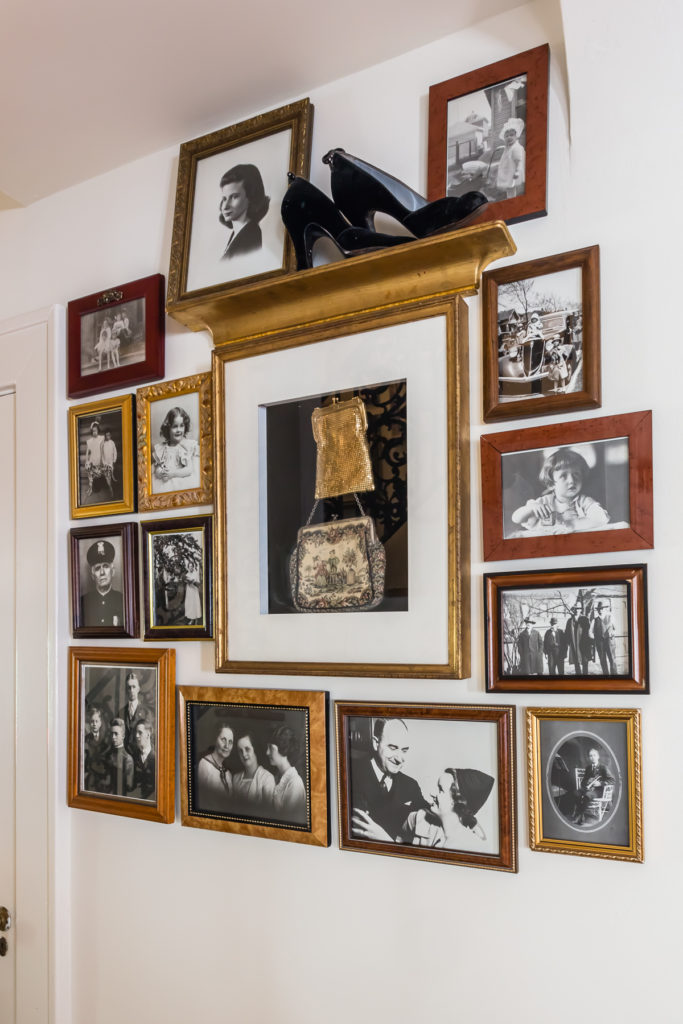 black and white family photos gallery wall salon style