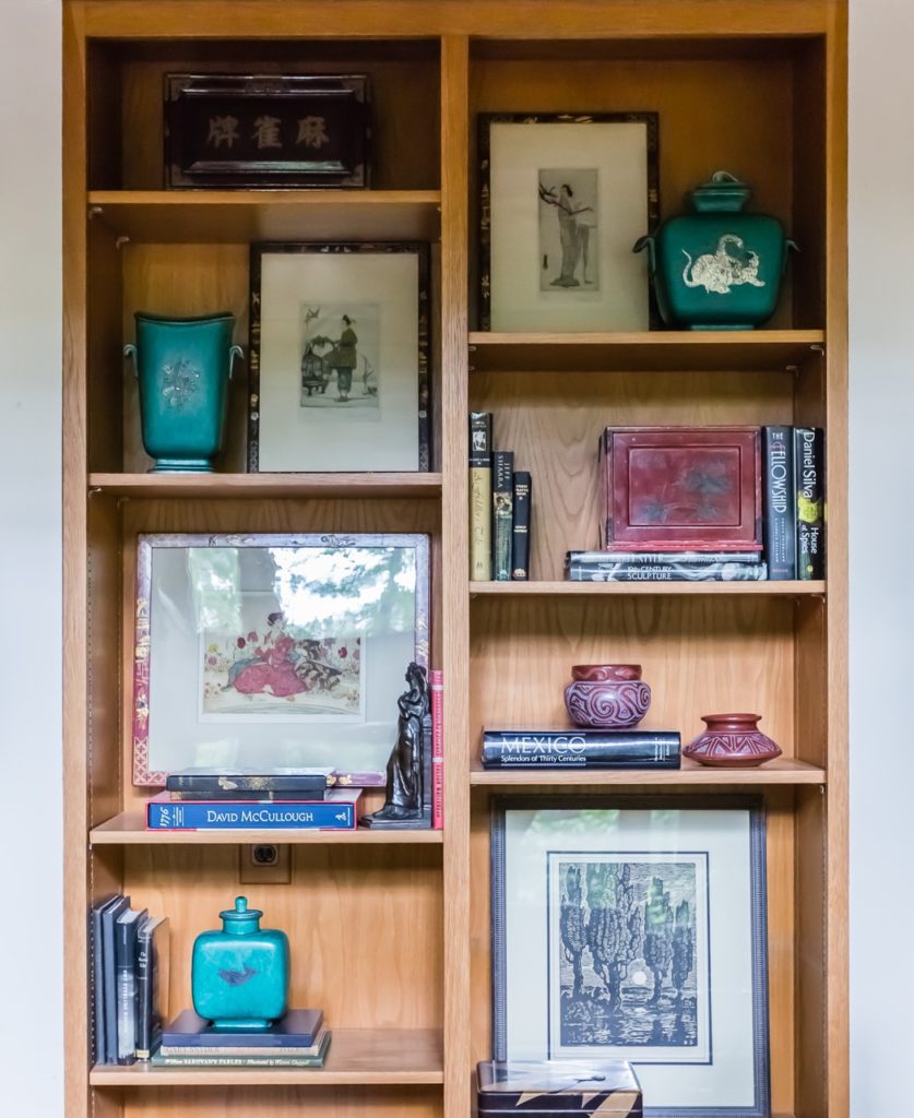 mid century modern bookshelf asian art collection