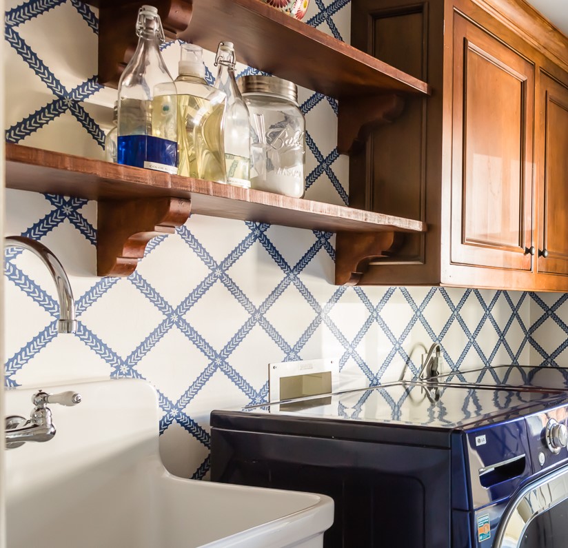 blue and white graphic wallpaper mudroom soap dispensers